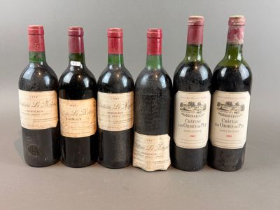 six bottles of wine are lined up in a row on a table