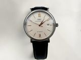 a close up of a wrist watch on a white surface