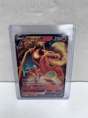 a close up of a pokemon card in a plastic case