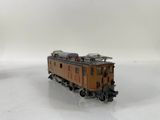 a toy train that is sitting on a white surface