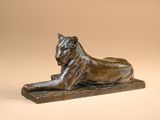 a bronze statue of a lion on a marble base