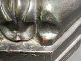 a close up of a statue of a cat on a table