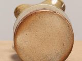 a close up of a vase on a table