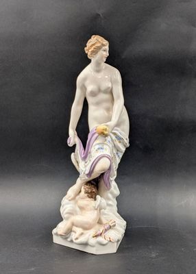 figurine of a man and a woman on a marble base