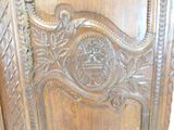 a close up of a wooden door with carvings on it