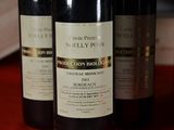 three bottles of wine that are on a table
