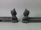 pair of cast iron bookends of a man and a woman on a bench