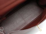 a close up of the inside of a brown leather handbag