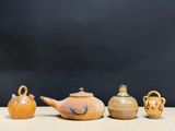 several different types of vases are lined up on a table
