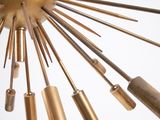 a gold colored chandelier hanging from the ceiling