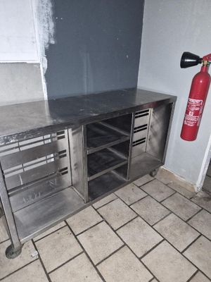 a fire extinguisher in the corner of a kitchen