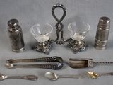 a lot of silver objects that are on the table