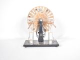a small model of a spinning wheel on a stand