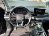 a dashboard of a car with a steering wheel and dashboard controls