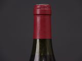 a bottle of wine that is sitting on a table