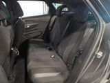 the back seats of a car are empty in a parking lot