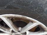 a close up of a tire on a car ' s rim