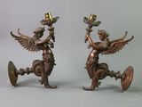 pair of antique bronze figurines of a winged woman and a man