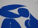 a blue and white sign with a man and a woman on it
