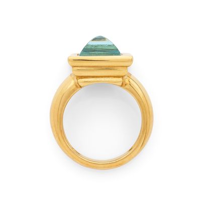 OJ PERRIN BAGUE retenant en son centre une topaze bleue pain…