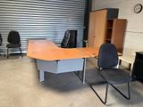an image of a desk and chair in a garage