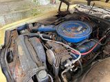 a small engine in the back of an old truck
