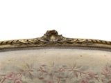 a close up of a couch with a floral pattern on it