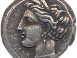 gros plan d'une pièce de monnaie sur laquelle figure une tête de femme