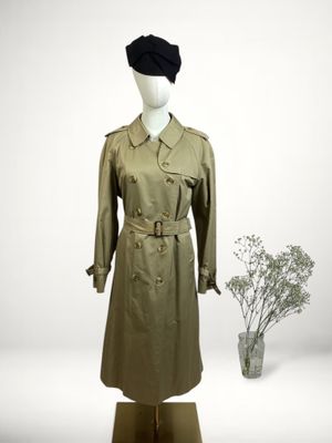 an image of a mannequin dressed in a trench coat