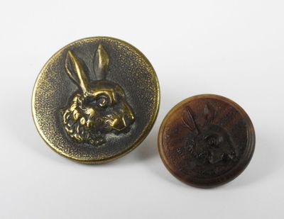 a close up of a button with a rabbit on it