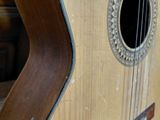 a guitar that is sitting on a wooden table