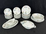 many plates and bowls on the table together