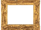 un cadre en or vieilli orné d'un motif décoratif sur fond blanc