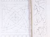 an open book with a drawing of a design on it