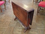 a small table that is sitting on a wooden floor