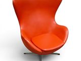 an orange leather chair with a metal base and a white background