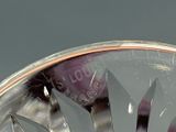 a close up of a glass bowl with fruit inside of it
