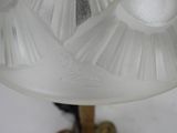 a glass lamp that is sitting on a table