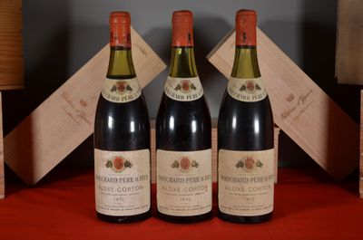 three bottles of wine are sitting on a red table cloth
