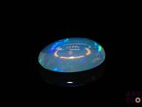 an image of a black background with a blue and white frisbee