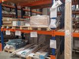 a large warehouse filled with lots of shelves and pallets