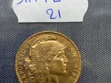 an old gold coin with a label on it
