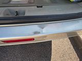 a trunk of a car with a bunch of items in it