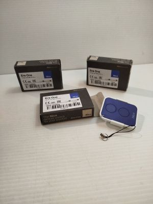 three electronic devices are sitting on a white surface next to each other