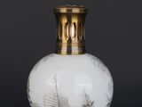 a white vase with a boat on it on a black background