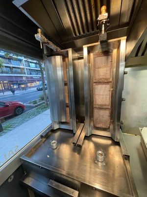 a view of a kitchen with a sink and a large window
