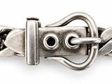 an image of a close up of a metal belt with a buckle