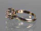 an image of a diamond ring on a reflective surface