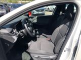 the interior of a car with the driver ' s seat folded down