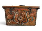 a wooden box with a floral design on it
